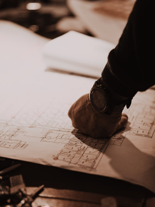 Engineer reviewing structural drawings for residential extension in London